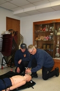two firefighters demonstrating CPR