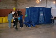blue decontamination tent with people